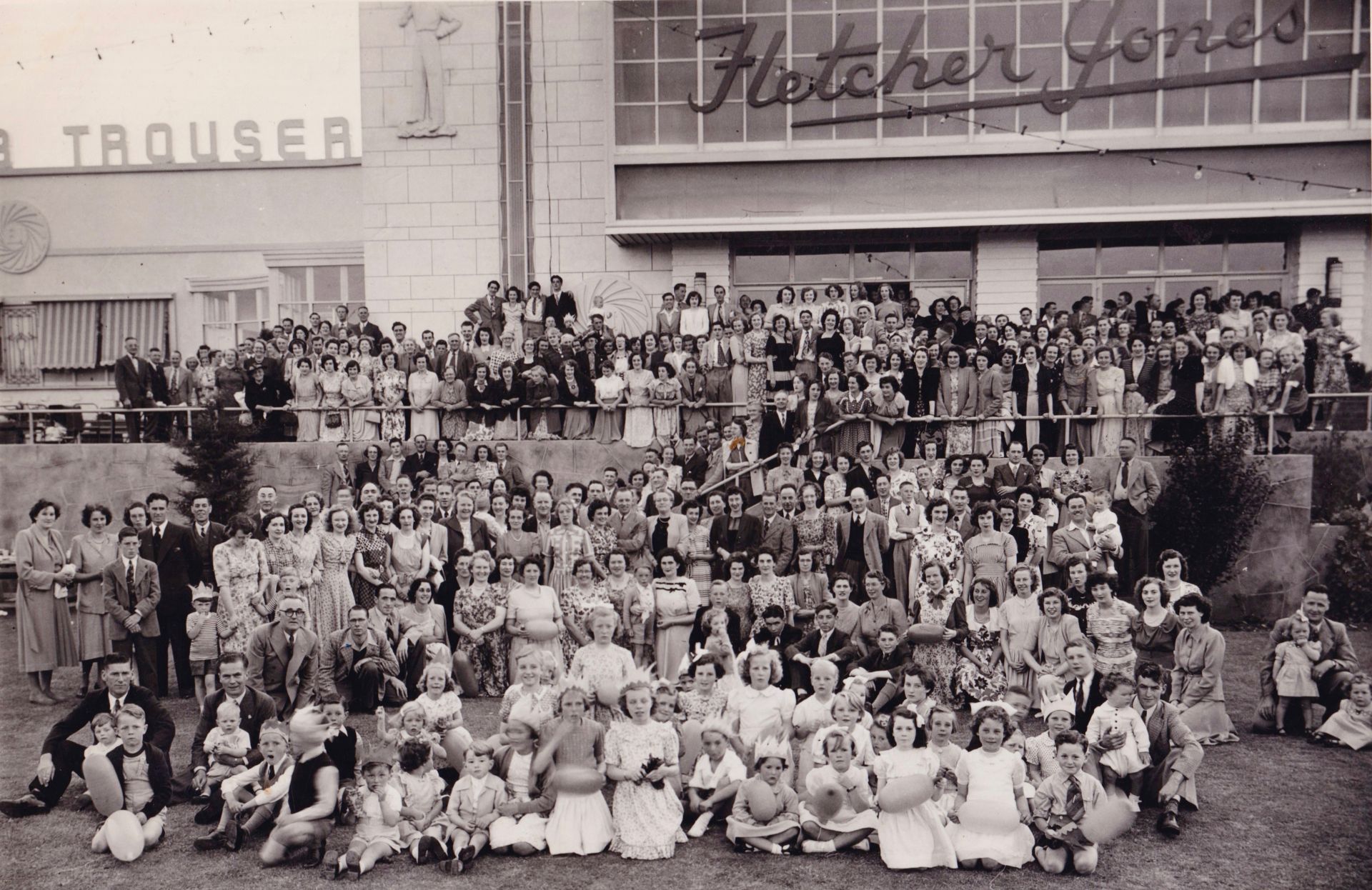 Christmas Party 1950's FJ Staff and families gather in front of the Pleasant Hill Factory. FJ is third from left in front just behind the kids. Photo:Alex Wilkins (shared by Danny and Marg O'Connor)