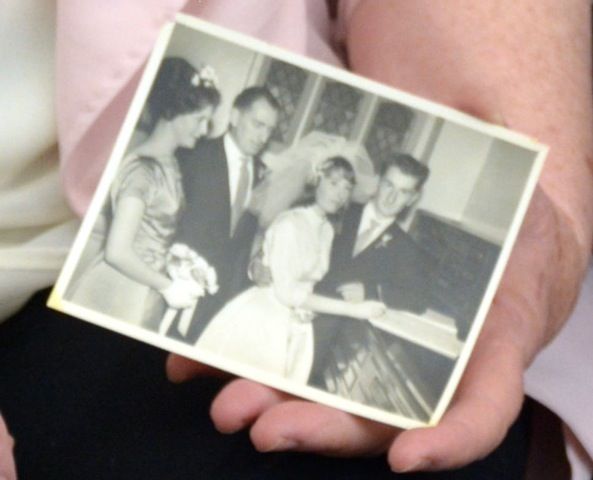 Jean holding the photo of her and Wally Paton on their wedding day.