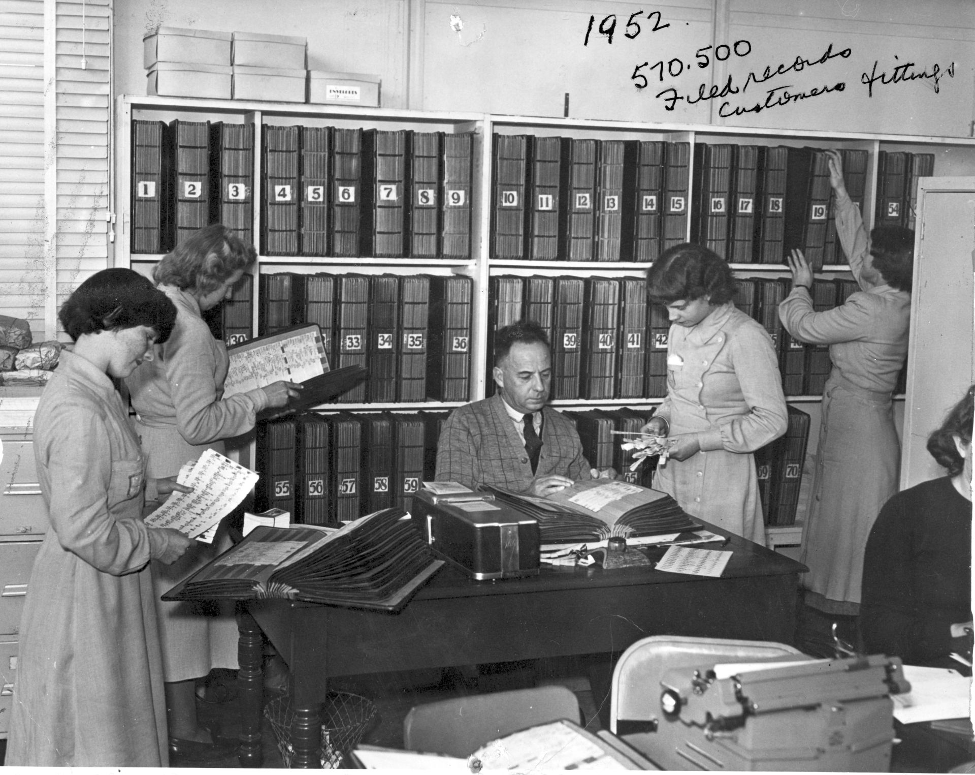 Mail order staff with part of the FJ extensive filing system - 1952.  Photo: Jones Family Collection 