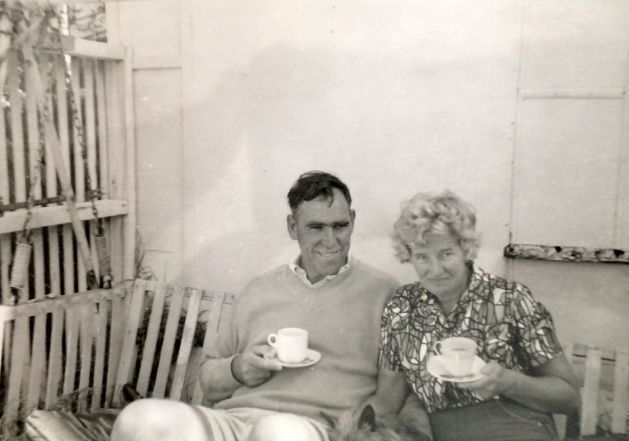 Tim and Peggy Carlton drinking tea in the hammock swing - on holiday at the FJ Port Fairy Bus around 1961.  