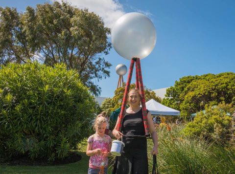 Tonia Wilcox, founder of the Save the Silver Ball and Fletcher's Gardens Facebook page, dressed as the Silver Ball with daughter Jenna,  fundraising at the 2016 community picnic in the FJ gardens for lighting up the silver ball on the city skyline.  Photo: Rosana Sialong 
