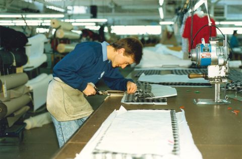Leigh Bradford cutting a ladies jacket in the 1980s in the cutting room at FJs. Photo: Jones Family Collection  