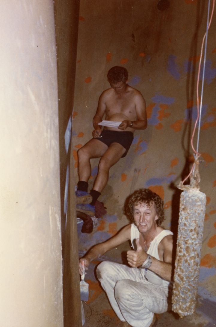 Keith Clark appears to be reading on the job while Kevin Fry gives the thumbs up with paint brush in hand! One of the anodes hangs to his right. Photo: Gary Kelly