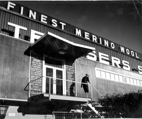 This evocative photograph of a woman leaving the FJ Factory shows the famous doors from FJs Collins St store.  Photo:Gordon deLisle via the Jones Family Collection