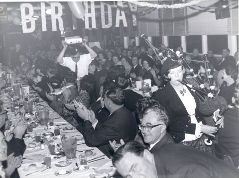 Maurice Bennoun holding the birthday cake above his head.  Maurice was the French chef in the FJ canteen.  Photo: shared by Yola Bennoun.  