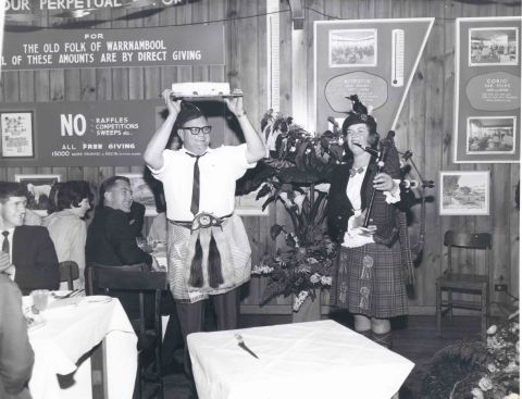 Dancing with the cake, Maurice Bennoun and unknown piper.  Photo: Alex Wilkins