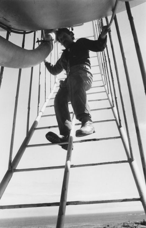 Descending the ball through the cage near the top of the ladder.  Photo:Fitzgibbon Family